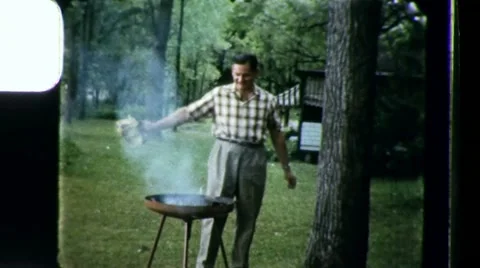 1960s Man Fans Coals Delicious BARBECUE BBQ Home Cooking Vintage Film Home Movie Stock Footage