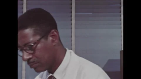 1960s: Man in lab. Machine in lab, machine connected to polygraph. Man in lab Stock Footage 212809354