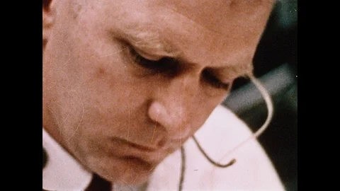 1960s: Man looking down in NASA mission control room. Men in front of console. 스톡 동영상 104768942