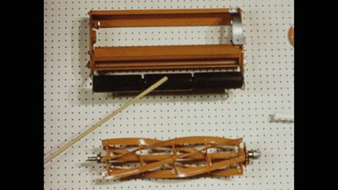 1960s: A man stands in front of display peg board. He points with a pointer to Stock Footage 151047823