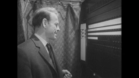 1960s: Man in voting booth struggles with a decision. Man votes but leaves the Stock Footage 80208950