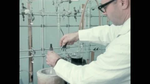 1960s: Man working in lab, adjusting equipment. Men assembling dinosaur Stock Footage 224309514