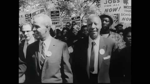 1960s: Martin Luther King Jr. and a mixed race group march in Selma, Alabama. Stock Footage
