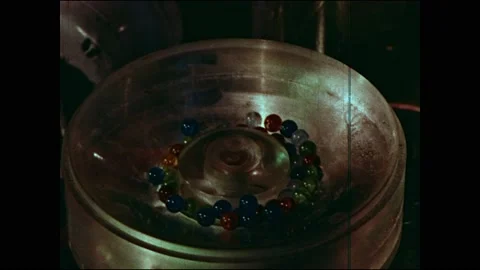 1960s: Men work on atomic reactor in lab. Atomic elements glow in saltwater bath Video stock 160169743