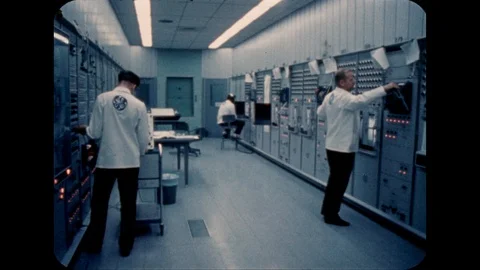 1960s: Men work with computers. Stock Footage 113943701
