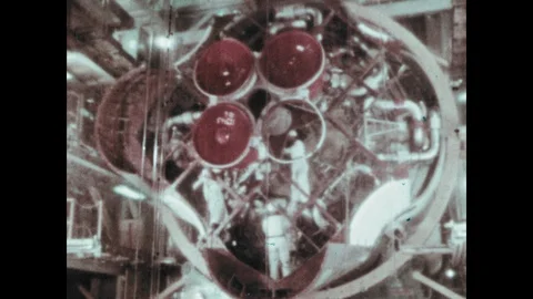1960s: Men work on rocket.  Curtain pulls back. 스톡 동영상 104881154