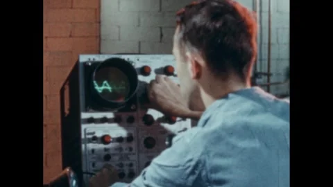 1960s: Men working at control panels. Man at panel, adjusting knobs. 스톡 동영상 259303943