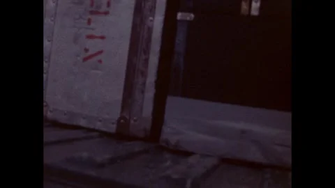 1960s: Metal crate, stenciling on side. Stock Footage 278432829