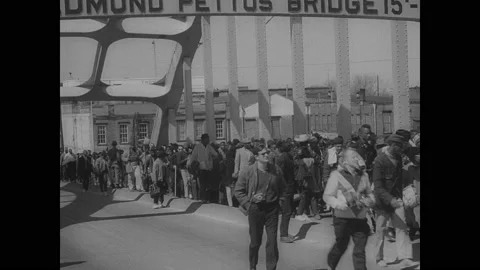 1960s: Military police escort civil rights marchers across bridge.  Martin Stock Footage