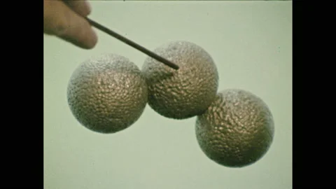 1960s: Model of three molecules together. Pointer points at molecule on left. Stock Footage 151041903
