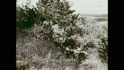 1960s: Native American men work in field.  Men hunt with bows and arrows.  Stock Footage 156342580