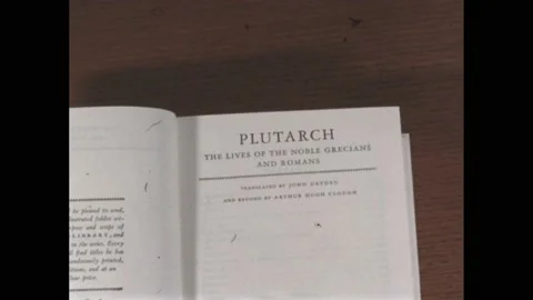 1960s: Open book on table. Hands closing book. Book on table. Stock Footage 171187950