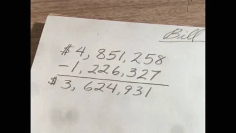 1960s: pencil points at numbers during mental arithmetic problem. Equation on Stock Footage 219965656