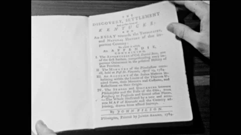 1960s: Person opens book, flips through pages to Appendix. Stock Footage 149641165