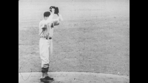 1960s: pitcher winding up and throwing, Babe Ruth hits homerun and runs around Stock Footage 121385326