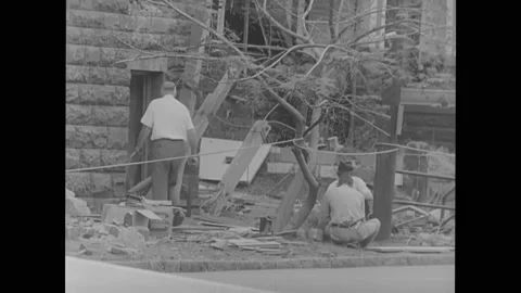 1960s: Police blocks off the intersection on 16th St in Birmingham. People exam Stock Footage 169233609