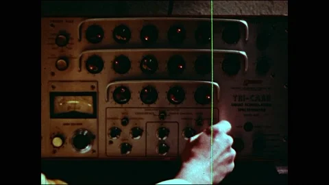 1960s: Printer moves in lab. Hands adjust knobs on computers. Man works on 스톡 동영상 160169755