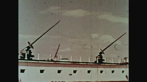 1960s: Radars on top of building point to different position in sky. Man looks Stock Footage 124817288