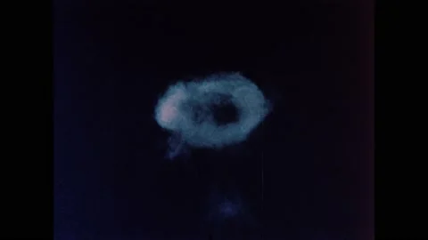 1960s: Radiation cloud from atomic bomb explosion rises in ring formation into Stock Footage 159489436