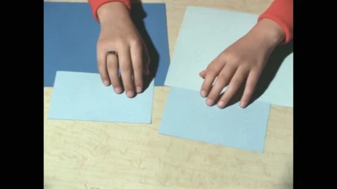 1960s: Rectangles of light blue paper on larger rectangles of contrasting shades Stock Footage 170856109