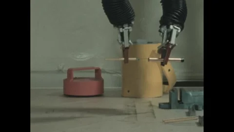 1960s: Robotic arms pick up objects.  Arms put knife together and take apart. Vídeos de archivo 247522710