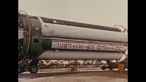 1960s: Rocket being pulled on runway. Truck pulling rocket part. Rocket 스톡 동영상 100643105