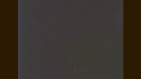 1960s: Rocket launch tower. Rocket test facility. Rocket booster moves to launch Stock Footage 77052834