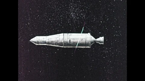 1960s: Rocket orbits on space, boosters fire. Line around earth shows path of Stock Footage 100302419