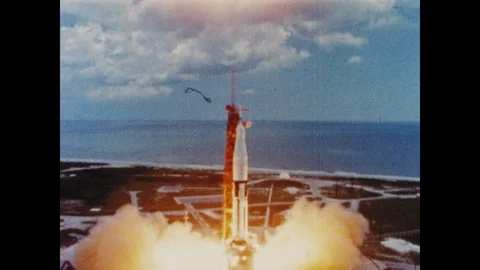 1960s: Rocket ship ignites and lifts off launch pad. Rocket ship lifts into sky. Stock Footage