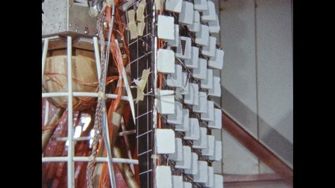 1960s: Satellite solar panel and antenna vibrates. NASA Nimbus satellite sits in Stock Footage 95289044