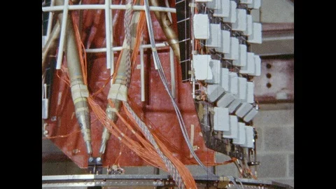 1960s: Satellite solar panel vibrates. Wires and tubes run along side of Stock Footage 95289023