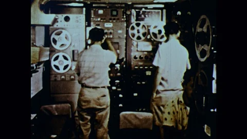 1960s: Scientist collects data in a computer lab. Images of solar eclipse. Stock Footage 126014656