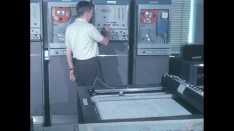 1960s: Scientist pushes buttons on computer in forecasting station. Printer Stock Footage 247522422
