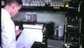 1960s SCIENTIST Reads LABORATORY Data Print-out Graph Vintage Retro Film Movie HD Footage