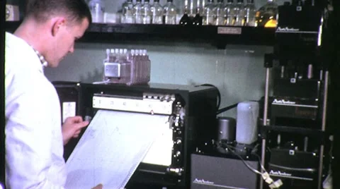 1960s SCIENTIST Reads LABORATORY Data Print-out Graph Vintage Retro Film Movie 動画素材 8952153