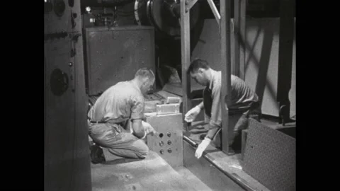 1960s: Scientists adding chemicals to nuclear reactor. Scientists removing Stock Footage 220430473