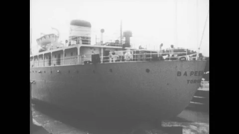 1960s: Ship moves. Map with locations. Industrial site. Crane at work Stock Footage 78506549