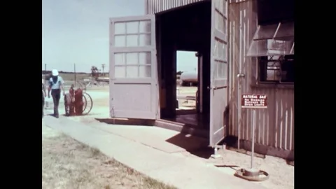 1960s: Sign Warning Garage Workers About Natural Gas on Premises Stock Footage