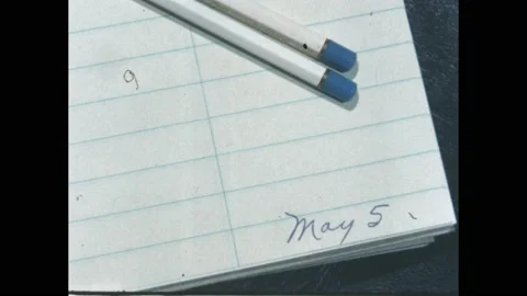 1960s: Slate. Dated steno pad and two pens. Slate. Woman with a steno pad talks Stock Footage 188798059