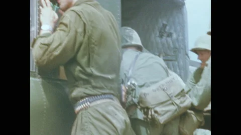 1960s: Soldier help load wounded soldier onto helicopter. Soldiers load mortar Video stock 151603134