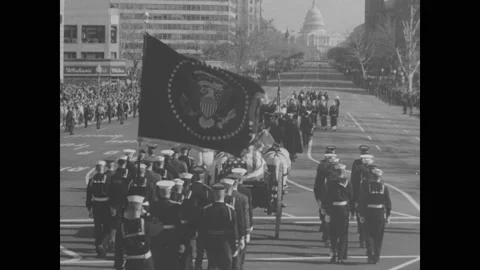 1960s: Soldiers march with horse drawn funeral wagon on Washington DC streets. Stock Footage