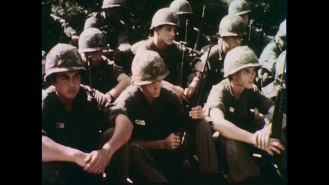 1960s: Soldiers sitting / Officer speaks to soldiers / Vietnamese sign / Officer Stock Footage