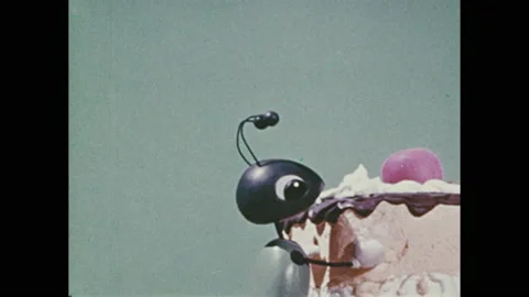 1960s: Stop-motion animation. Father ant finds piece of cake and sends out Stock Footage