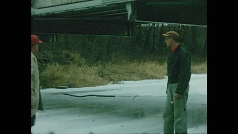1960s: string hanging across Cedar Creek indicating no passing, man fishing in Stock Footage 142592519