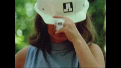 1960s: Students search plot for arrowheads. Boy looks at relic. Heavy machinery Vídeos de archivo 88792386
