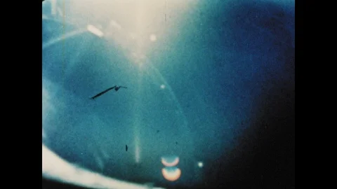 1960s: Sunlight from solar eclipse reflects off surface of Gemini space craft. Stock Footage 101665534