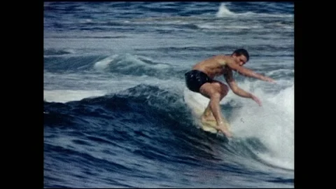 1960s Surfing - surfer does a spinner and hangs five. Video stock 148353634