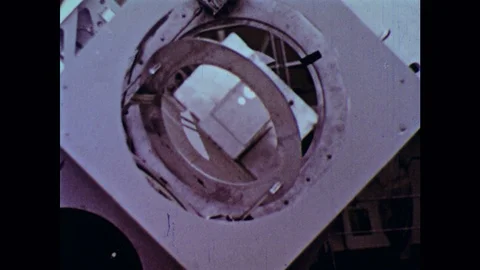 1960s: Telescope hatch opens. Teletype machine types out paper. Man types. Radio Vídeos de archivo 126014610