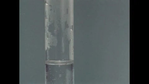 1960s: Test tubes.  Thermometer.  Temperatures appear.  Graph. Stock Footage 257364829