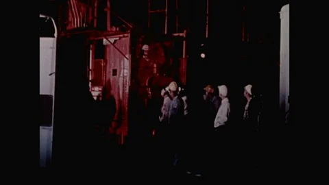 1960s: Tilt up, elevator on rocket launch tower ascending. 動画素材 109216623